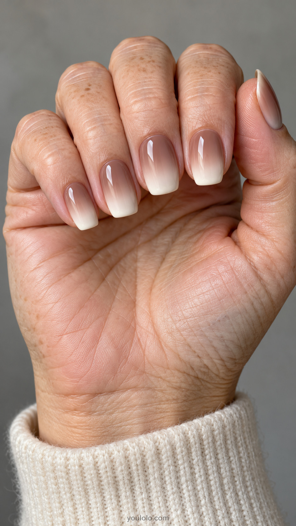 Medium rounded square nails: smooth warm mocha at cuticles fading to milky ivory tips on every nail, creamy gradient no glitter.