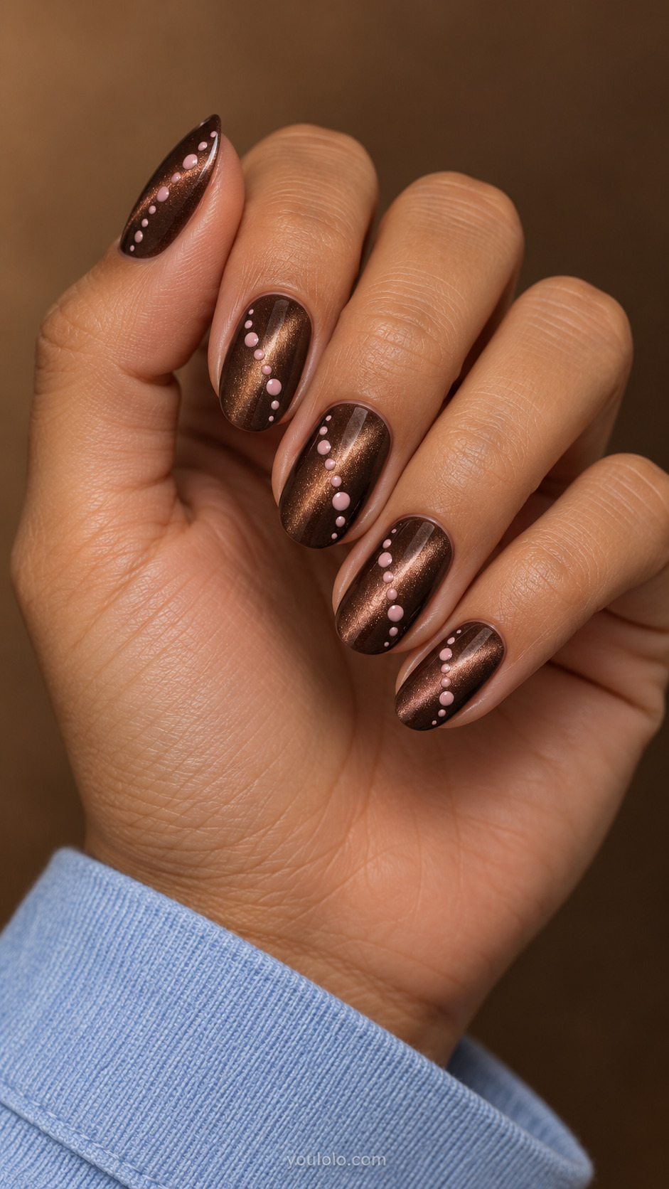 Pink Dots Across a Cocoa Beam manicure on medium oval.