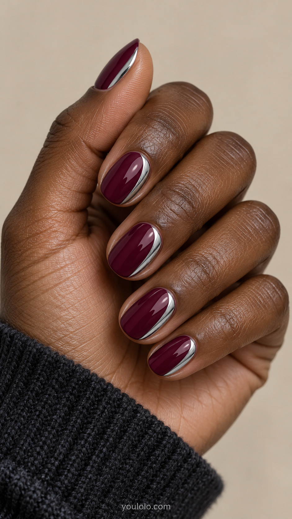 Deep berry oval nails with one slender platinum chrome side crescent per nail.