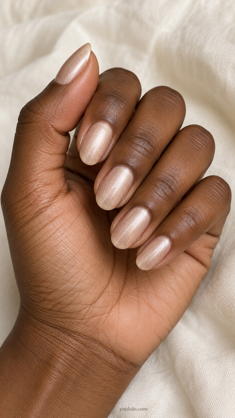 Medium oval nails pale muted champagne satin shimmer no glitter no chrome