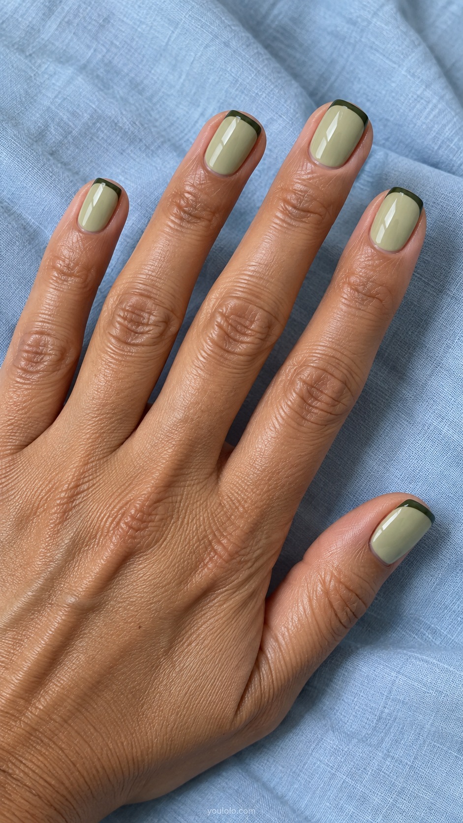 Short squoval nails muted pistachio green cream with thin fir green French tips