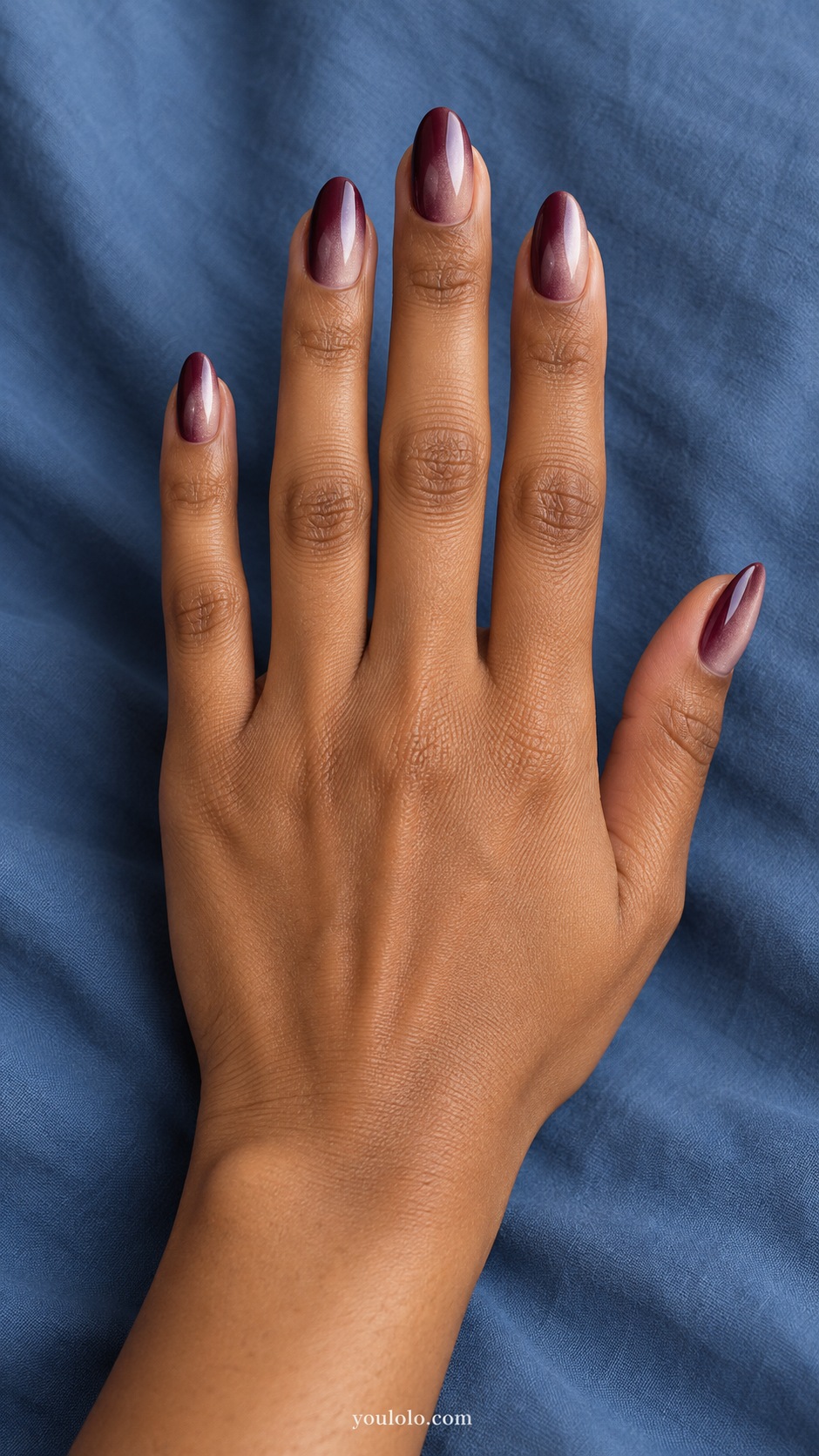 Medium almond lateral gradient deep burgundy one side to sheer smoky rose other side, fine pearl veil