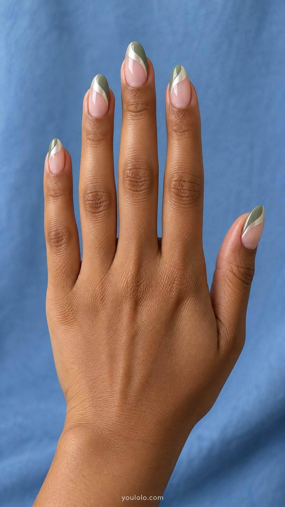 Medium almond sheer nude glazed nails tips divided into unequal sage green and ivory pearlescent curved sections