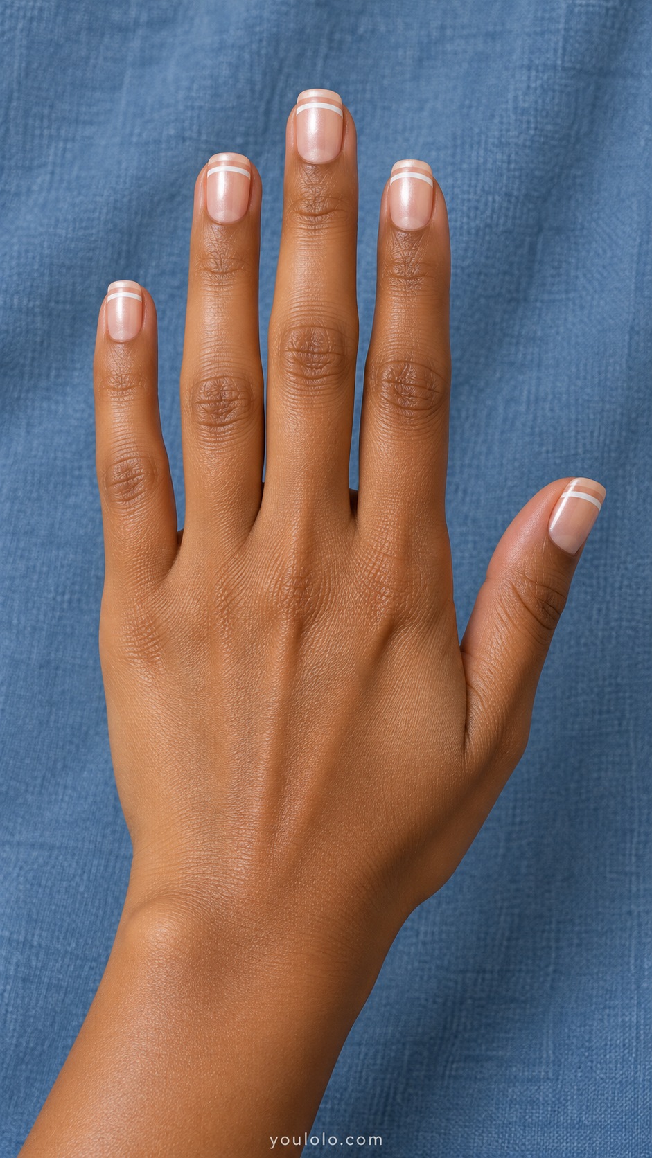 Short square pale peach pearl nails two narrow parallel straight white tip stripes with peach gap