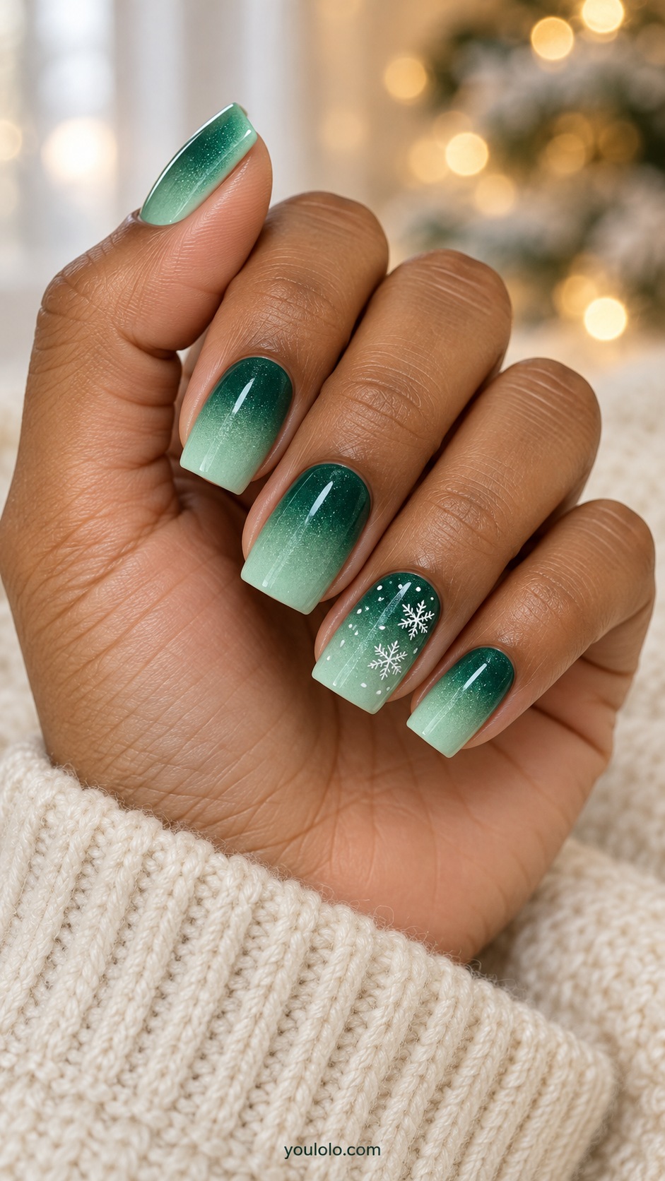 Medium square nails gradient emerald cuticle to pale mint tips with fine white snow dots on ring nail