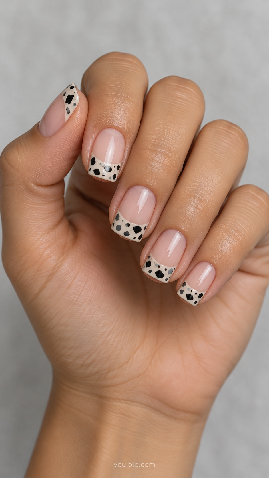 Monochrome Terrazzo Tips on short squoval nails with a nude base