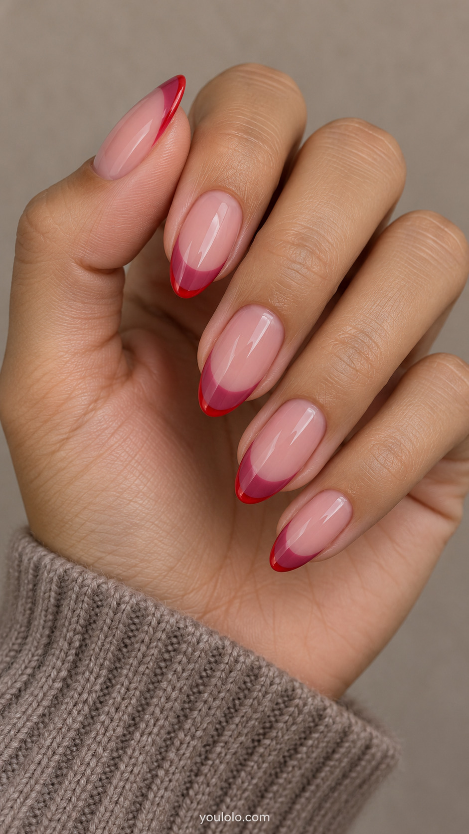 medium almond sheer rose nails, dark pink French crescent with narrow bright red outer free-edge border on a naturally gathered hand