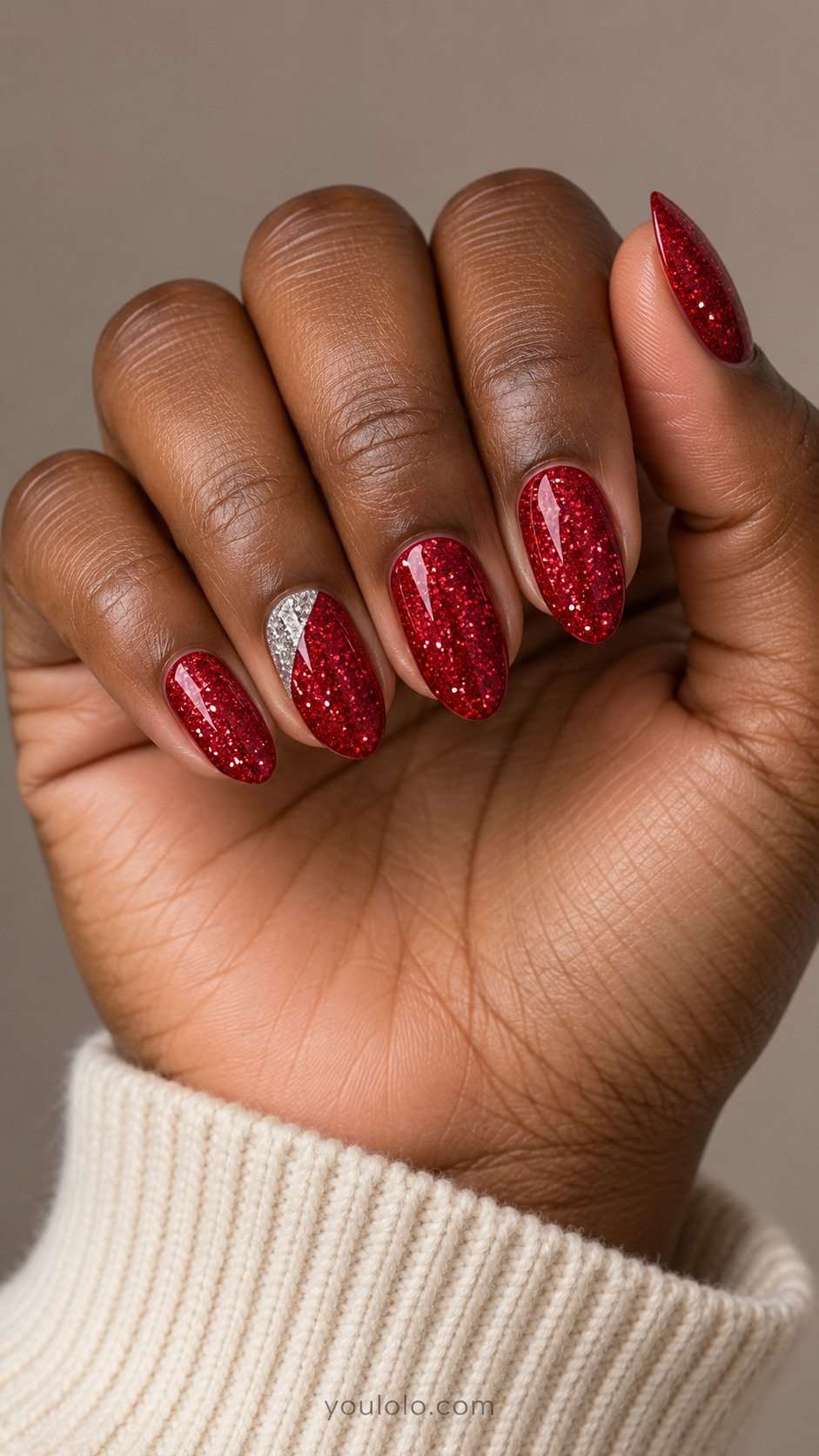 Ruby glitter almond nails with a silver corner on the ring finger