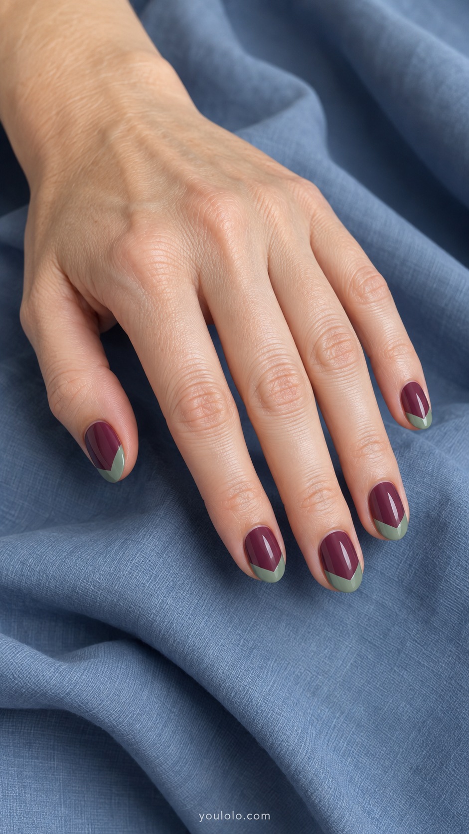 Short oval nails mulberry cream with sage green shallow V chevron tips