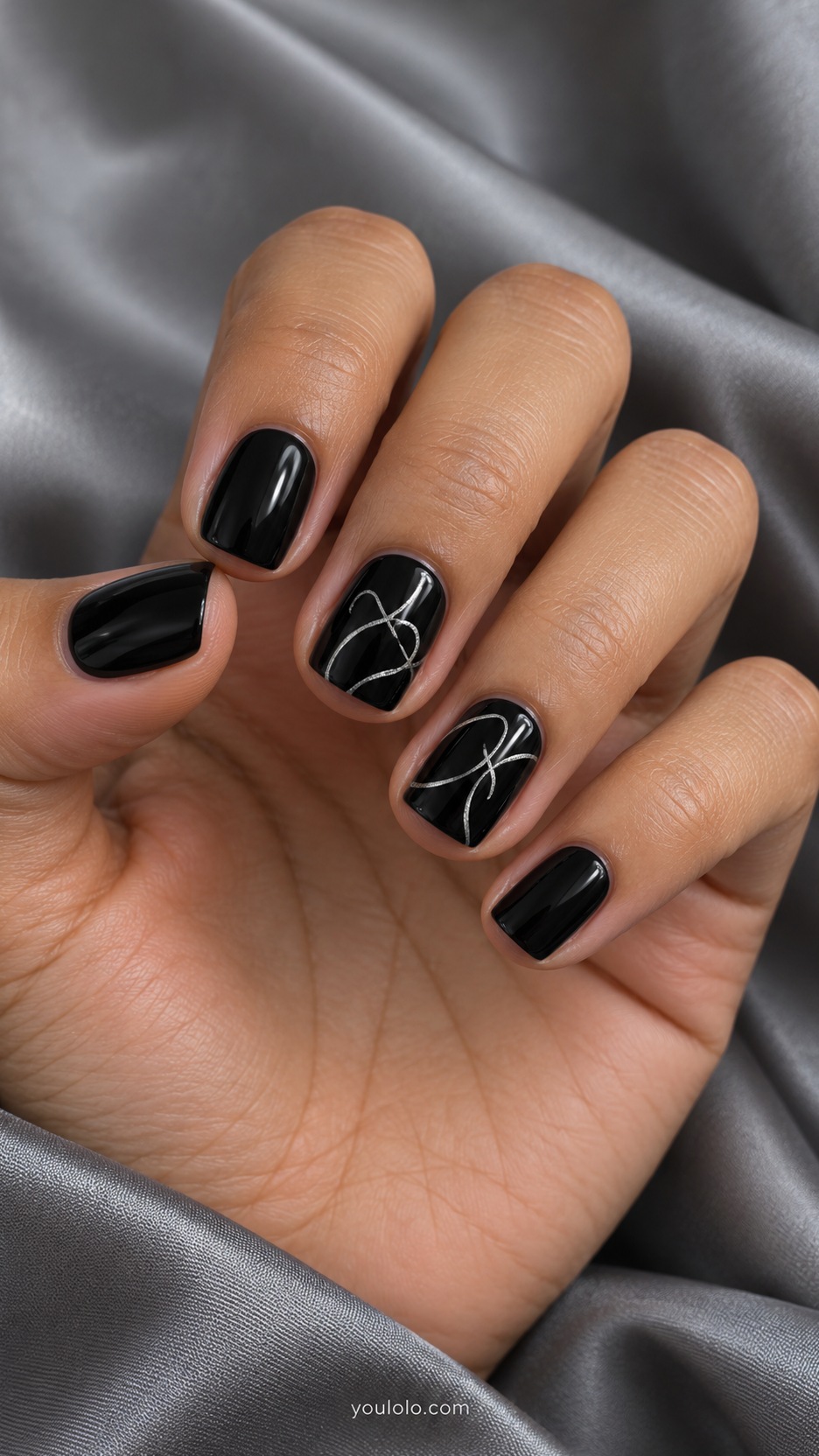 Short Artsy Nails: Silver Scribble Accents manicure on a naturally posed hand