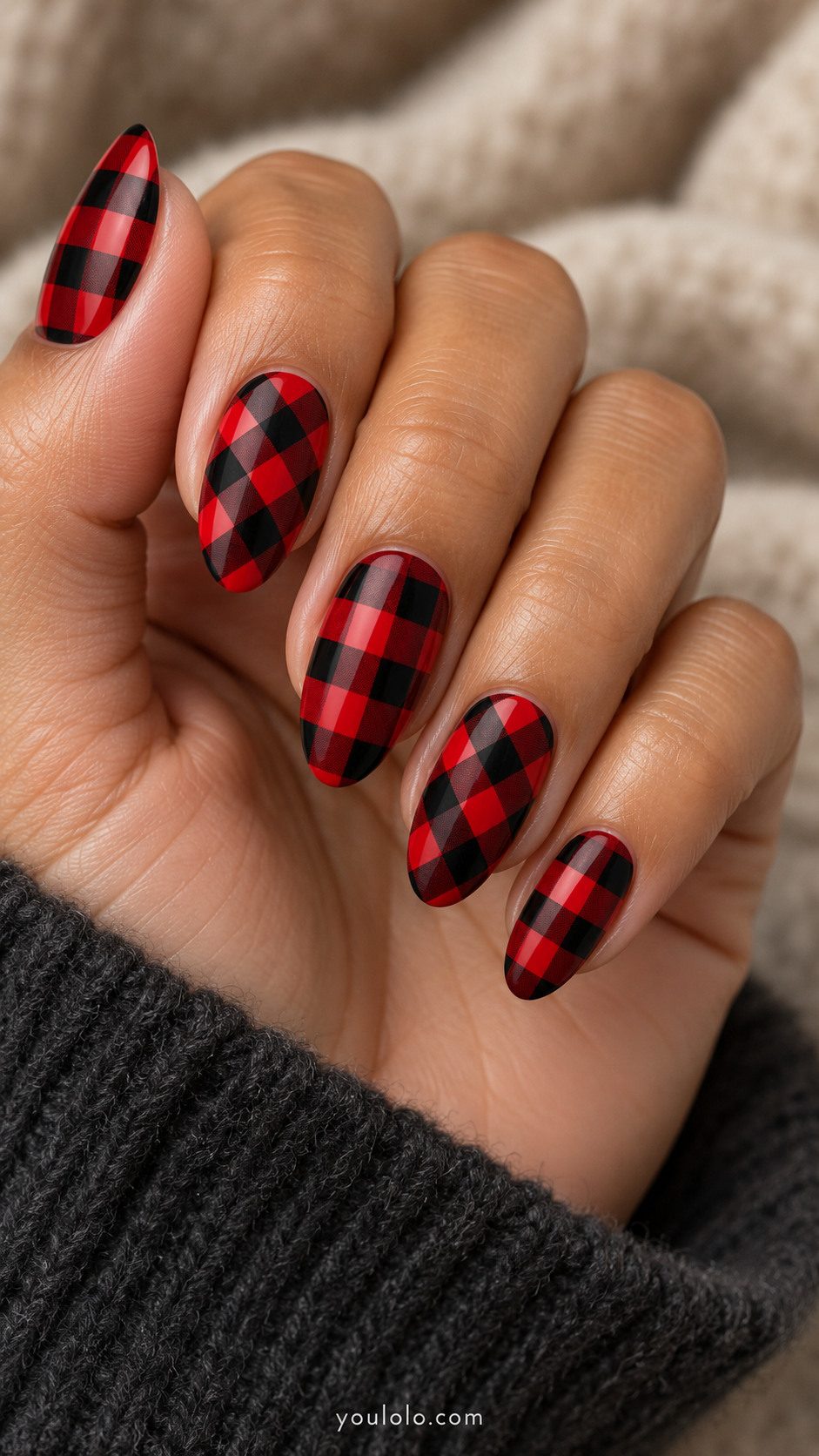 Almond nails alternating upright and diagonal red-and-black buffalo checks