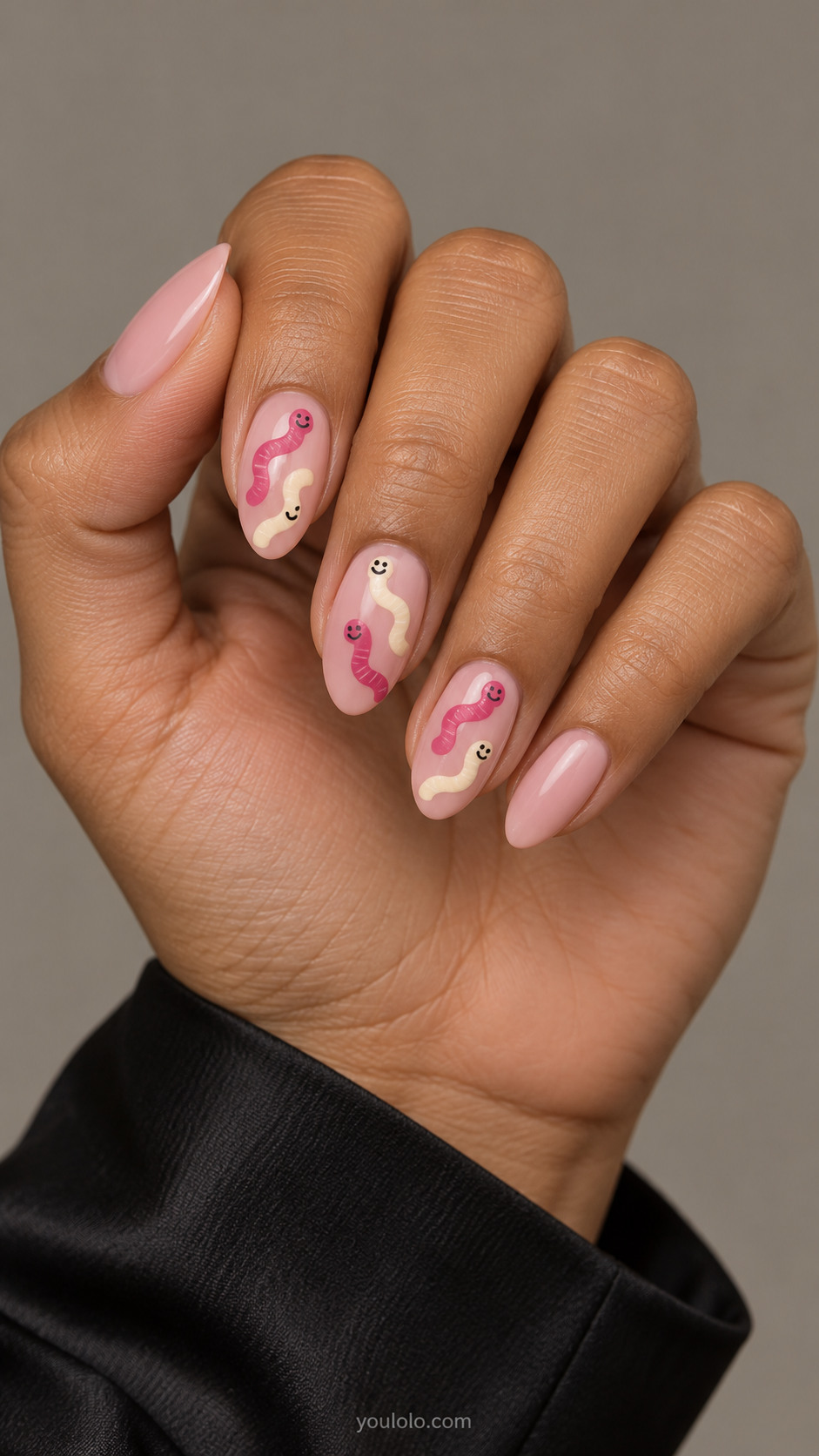 Pink almond nails with raspberry and cream candy-worm wiggles