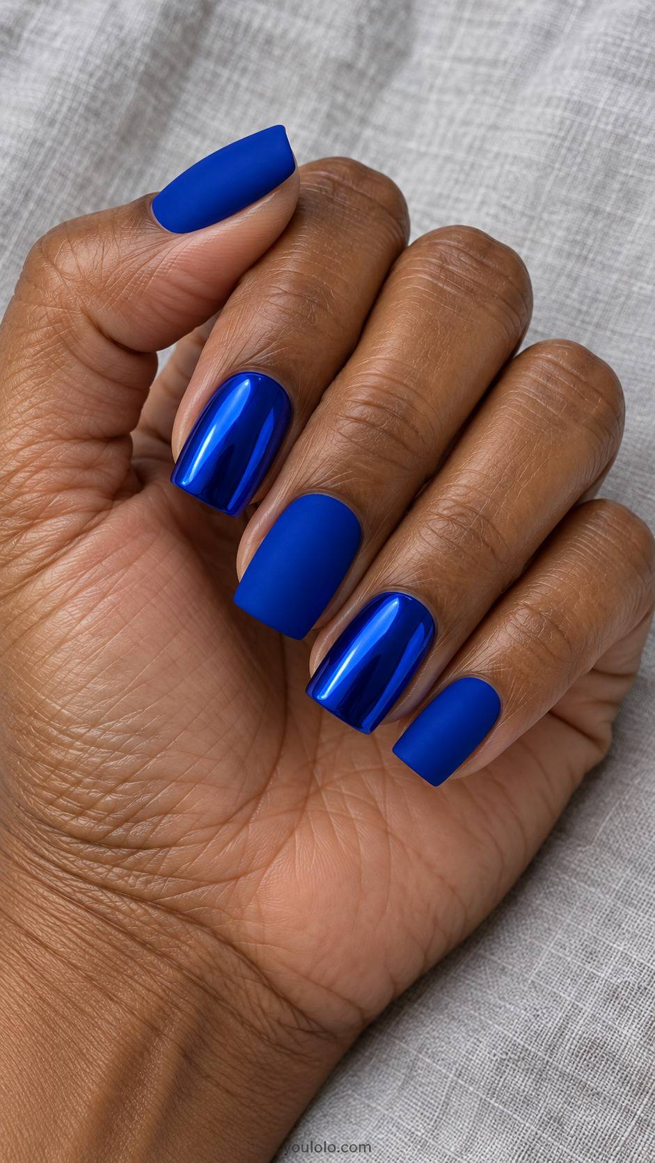 Square nails alternating matte royal blue and reflective blue chrome
