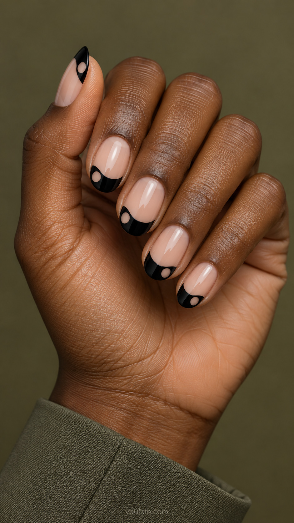 Orbit Cutout French on round nails with a nude base
