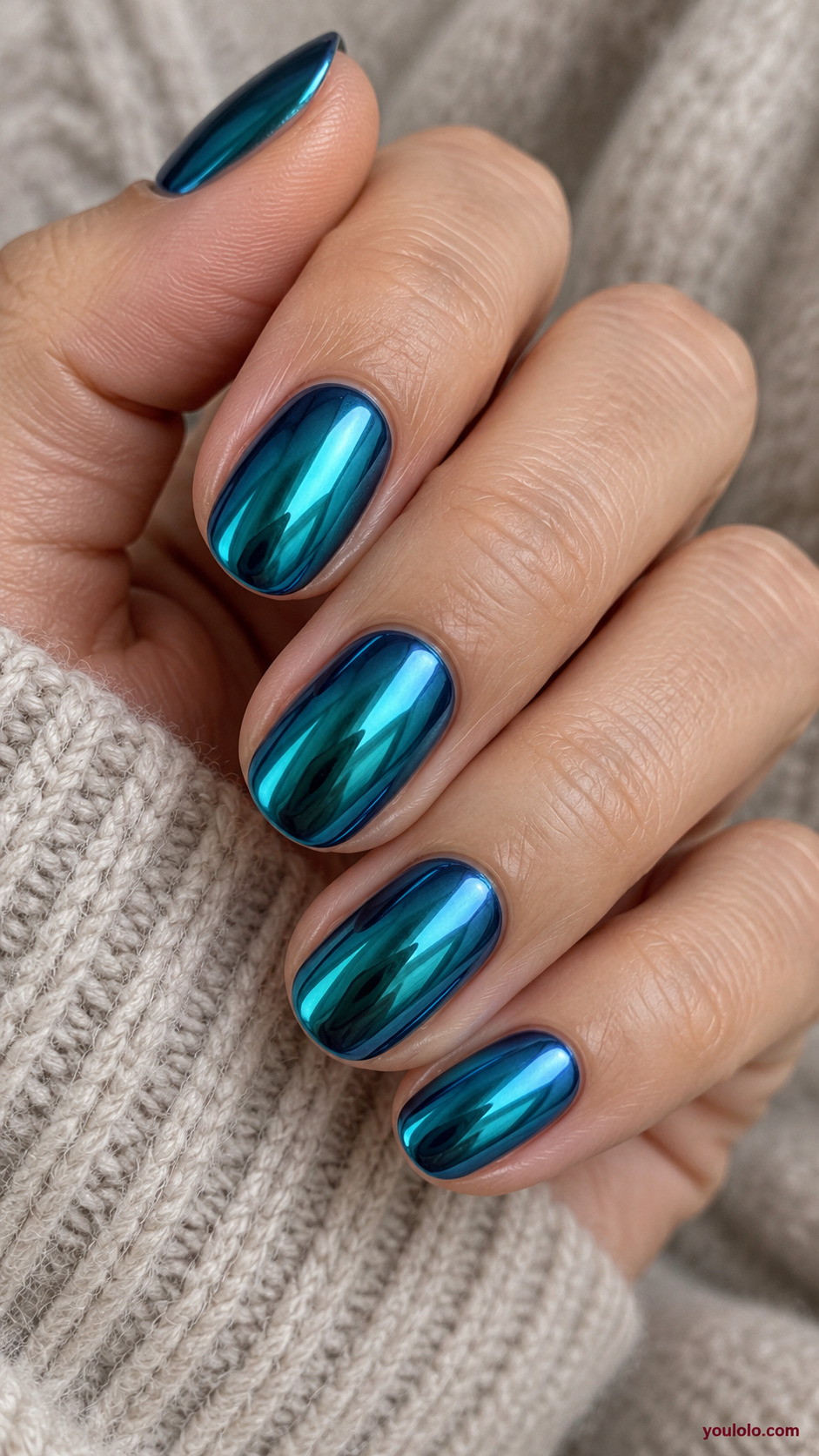 Teal-to-Blue Chrome Shift on a naturally gathered feminine hand showing the nail finish