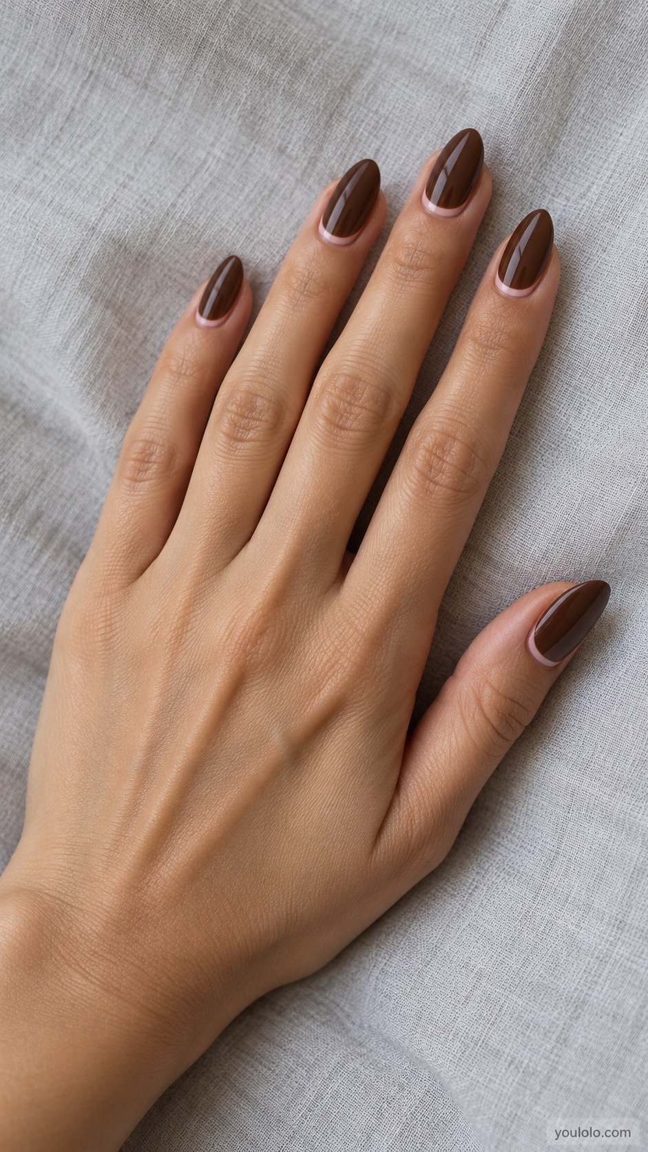 Chocolate Pink Cuticle Arc — medium almond chocolate nails fine pale pink curved arc at cuticle