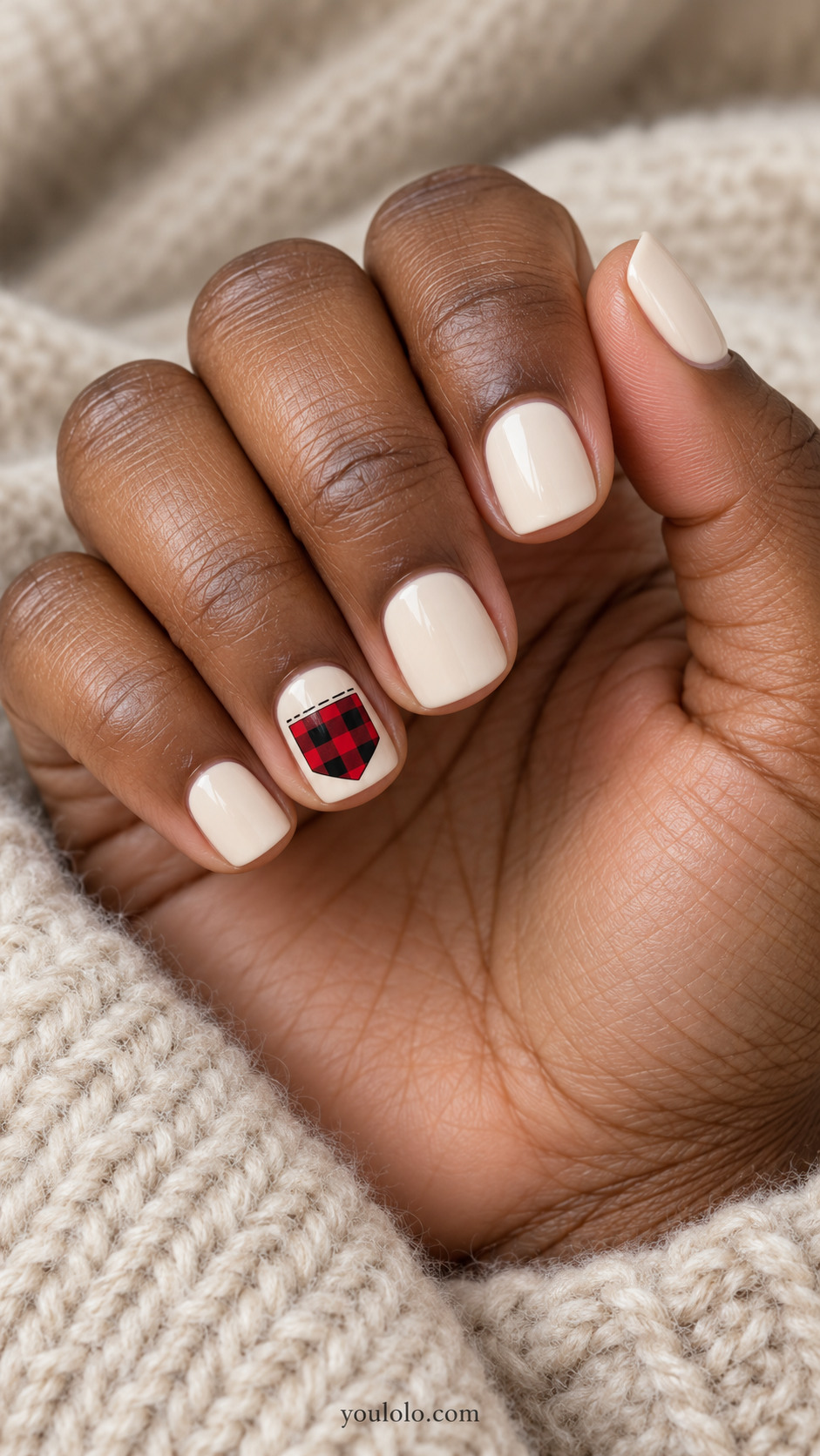 Cream short square nails with a red-and-black plaid pocket accent