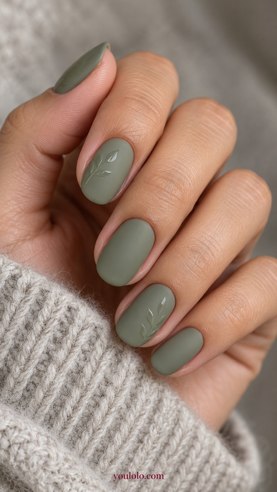 Glossy Leaf Silhouettes on Matte Sage on a softly gathered feminine hand with a matte green manicure