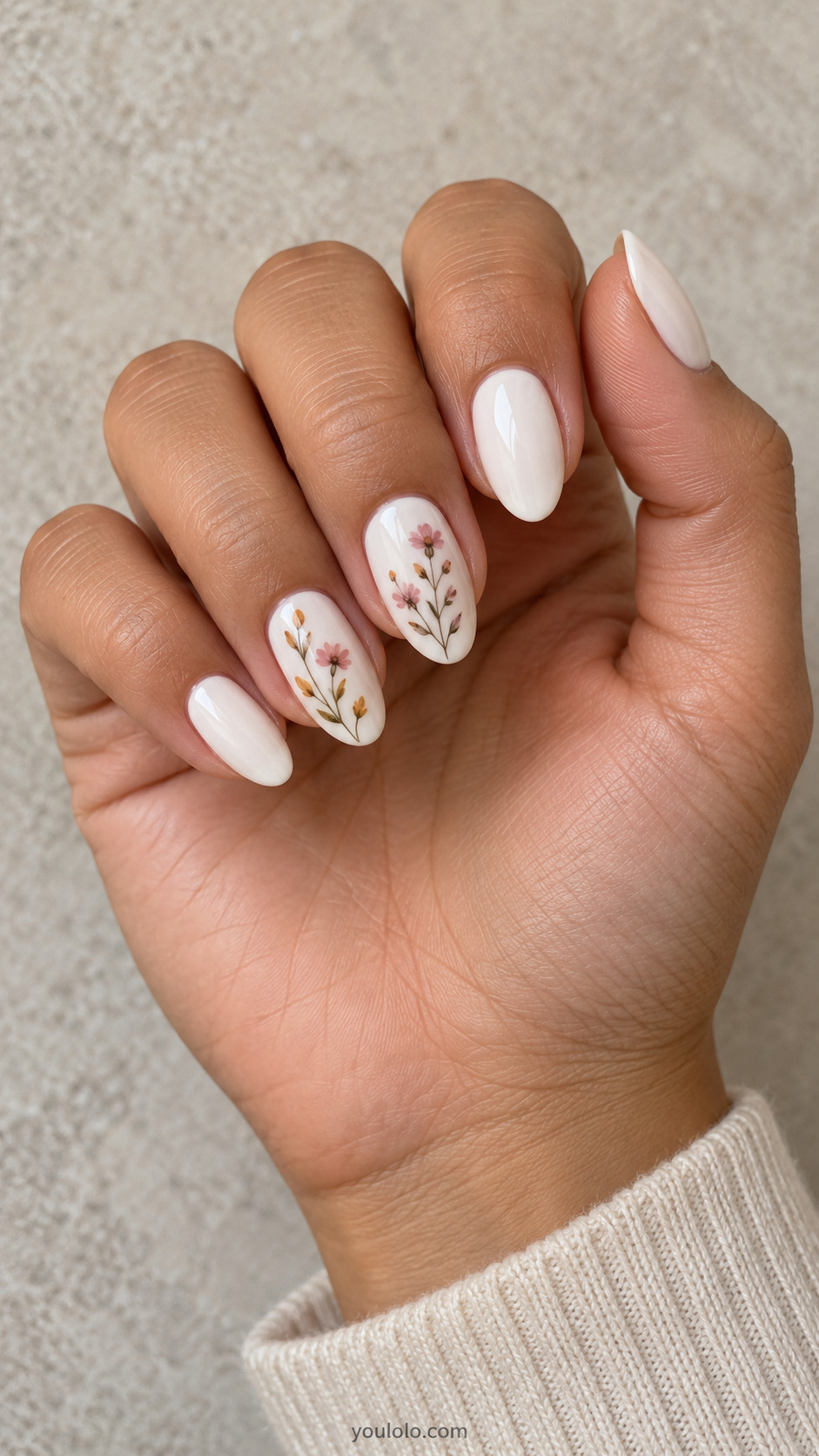 White almond nails with tiny painted dusty pink and ochre wildflowers
