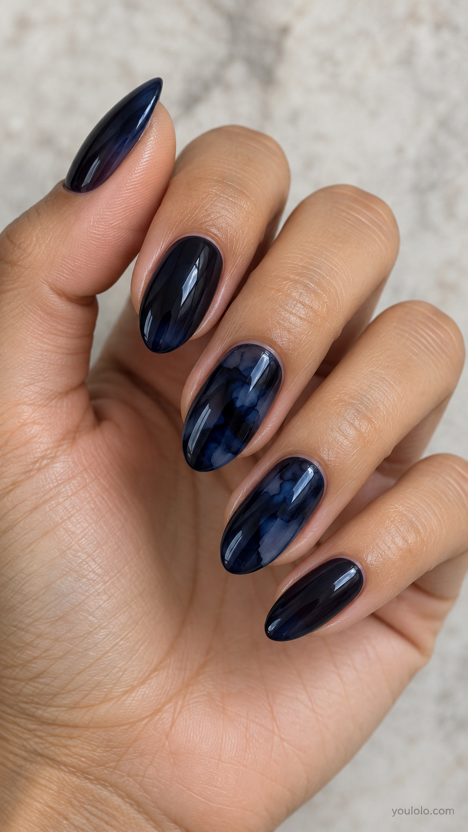 Midnight Jelly with Ink Blots on a naturally posed hand, showing dark blue polish and detailed nail art