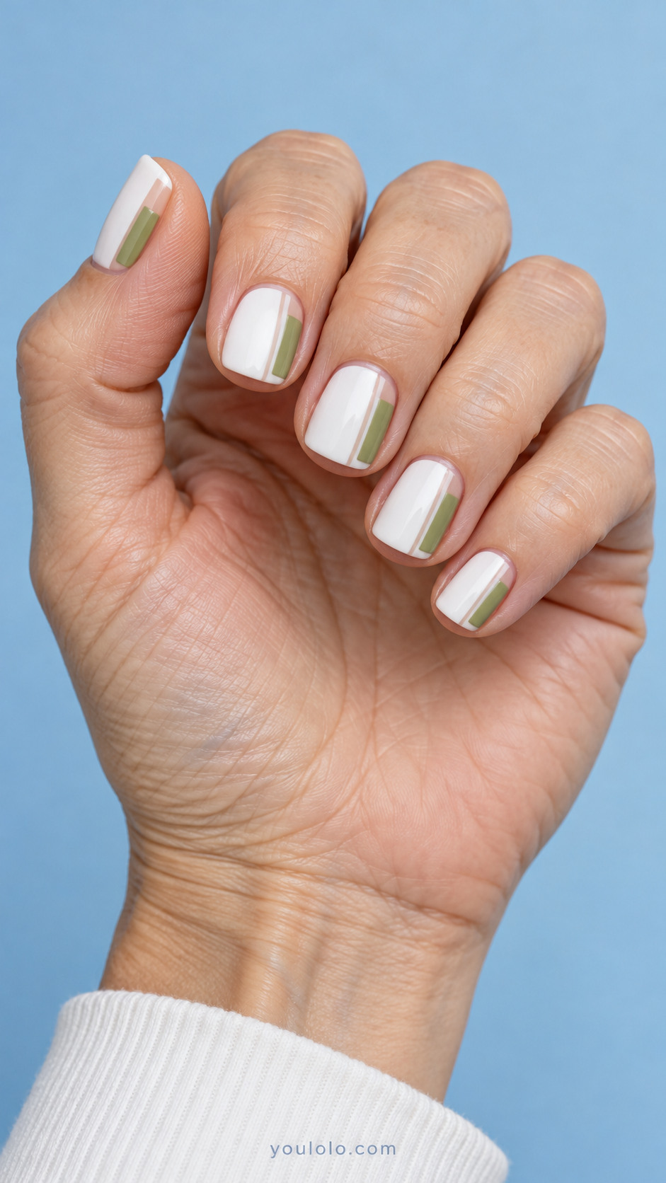 Short white square nails with pistachio side blocks and narrow nude gaps