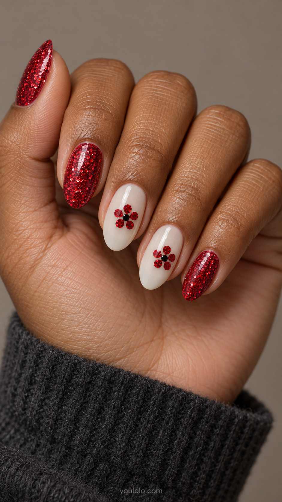 Red glitter almond nails with ivory sequin-flower accents