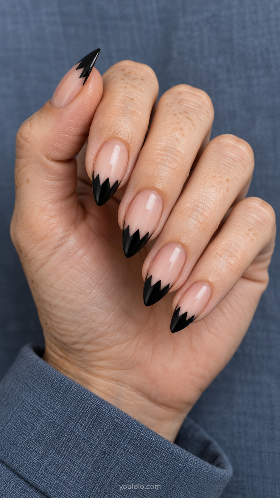 Serrated Graphic Tips on pointed nails with a nude base