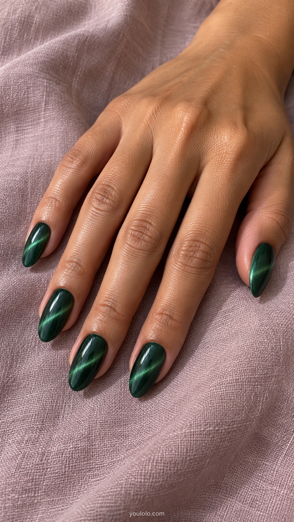Emerald with a Crisp Diagonal cat eye nails — Medium almond deep forest emerald magnetic nails with narrow diagonal bright green beams.