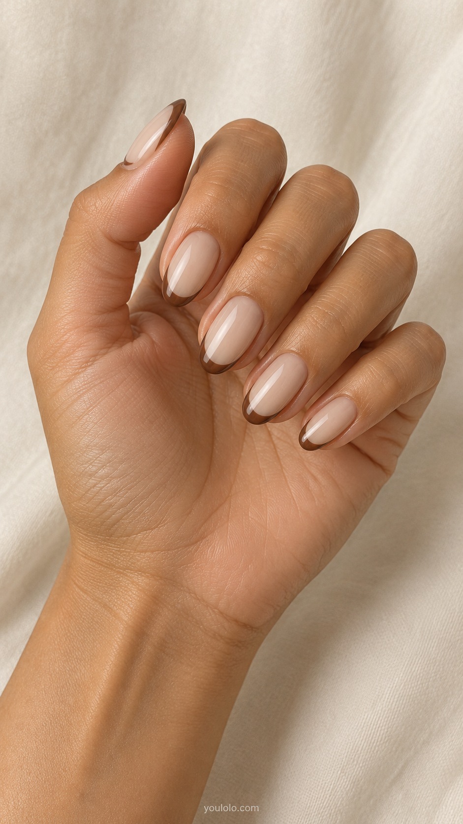 Mocha Negative Space Arch — medium oval sheer beige nails medium mocha brown curved arch outline following tip and side open at cuticle