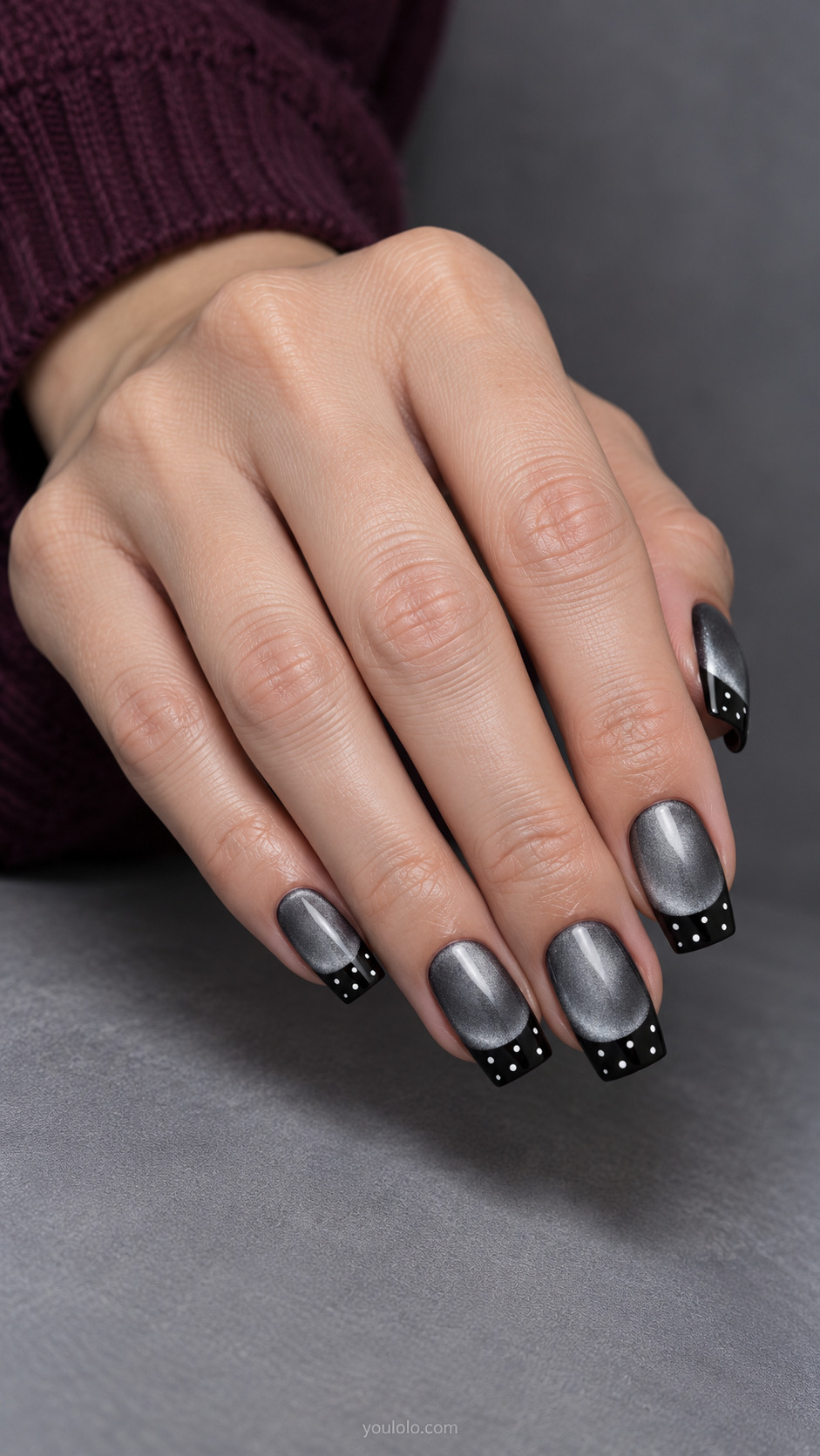 Dotted French Over a Silver Glow manicure on medium soft-square.
