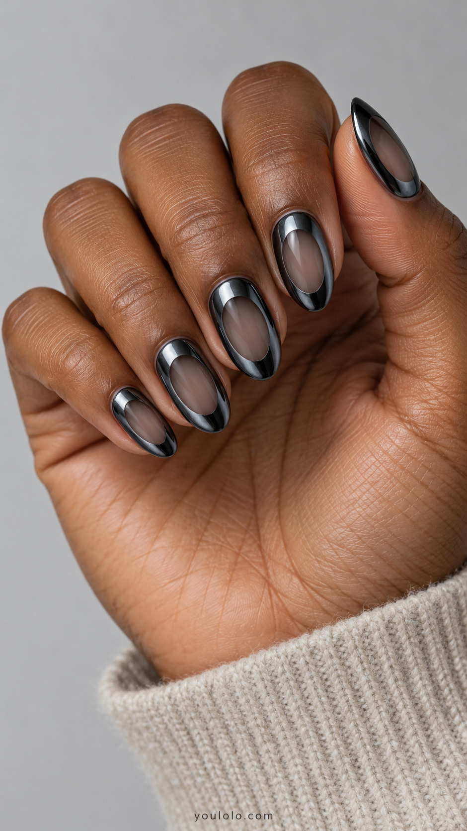 Medium oval dark gunmetal chrome perimeter framing one irregular sheer smoky oval window per nail, no raised outline no metal oval inset
