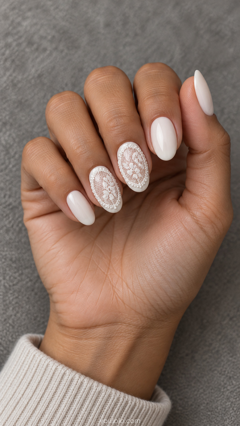 White oval nails with delicate white lace over sheer oval accent windows
