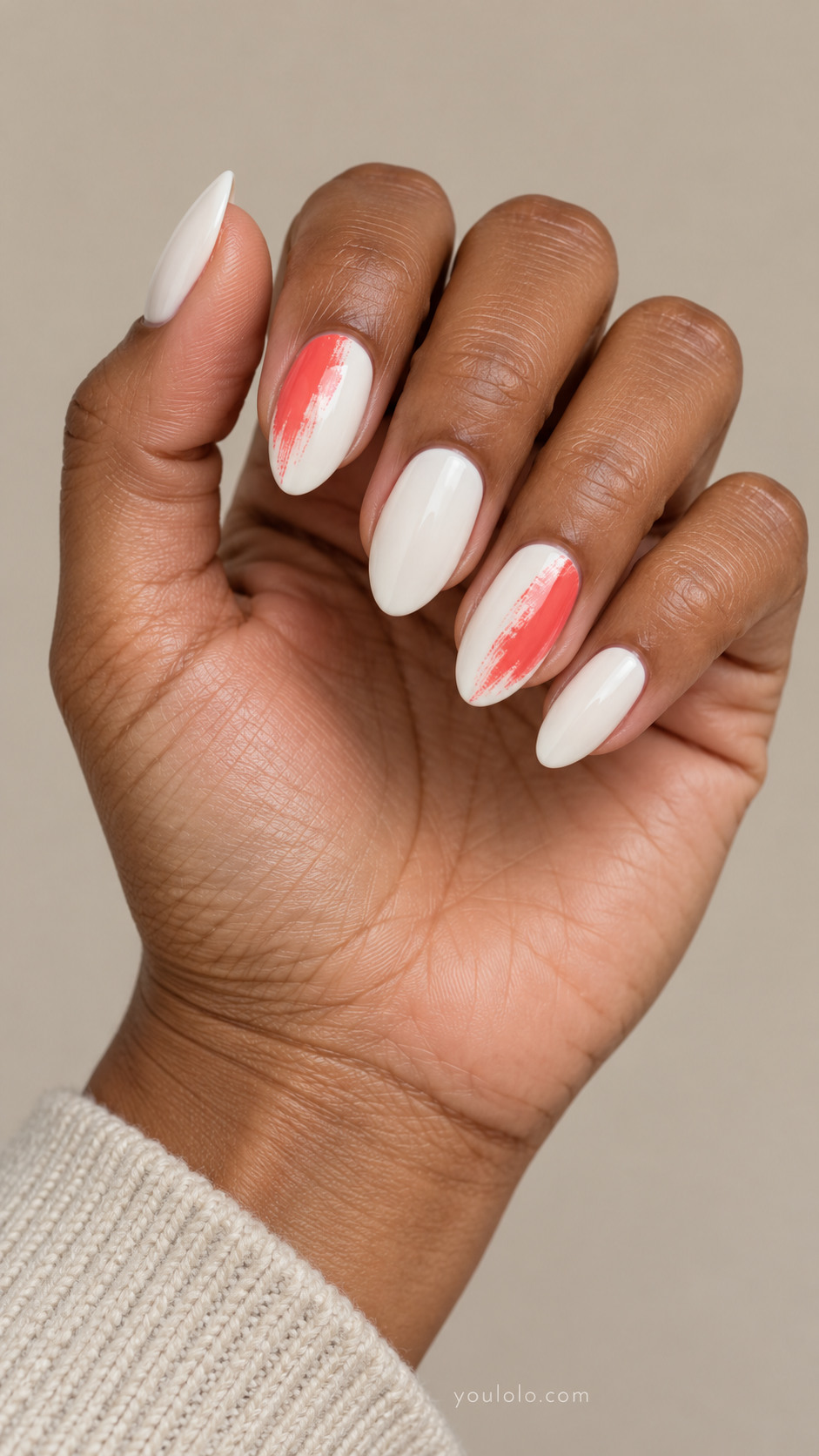 White almond nails with coral drybrush sweeps on two accent nails