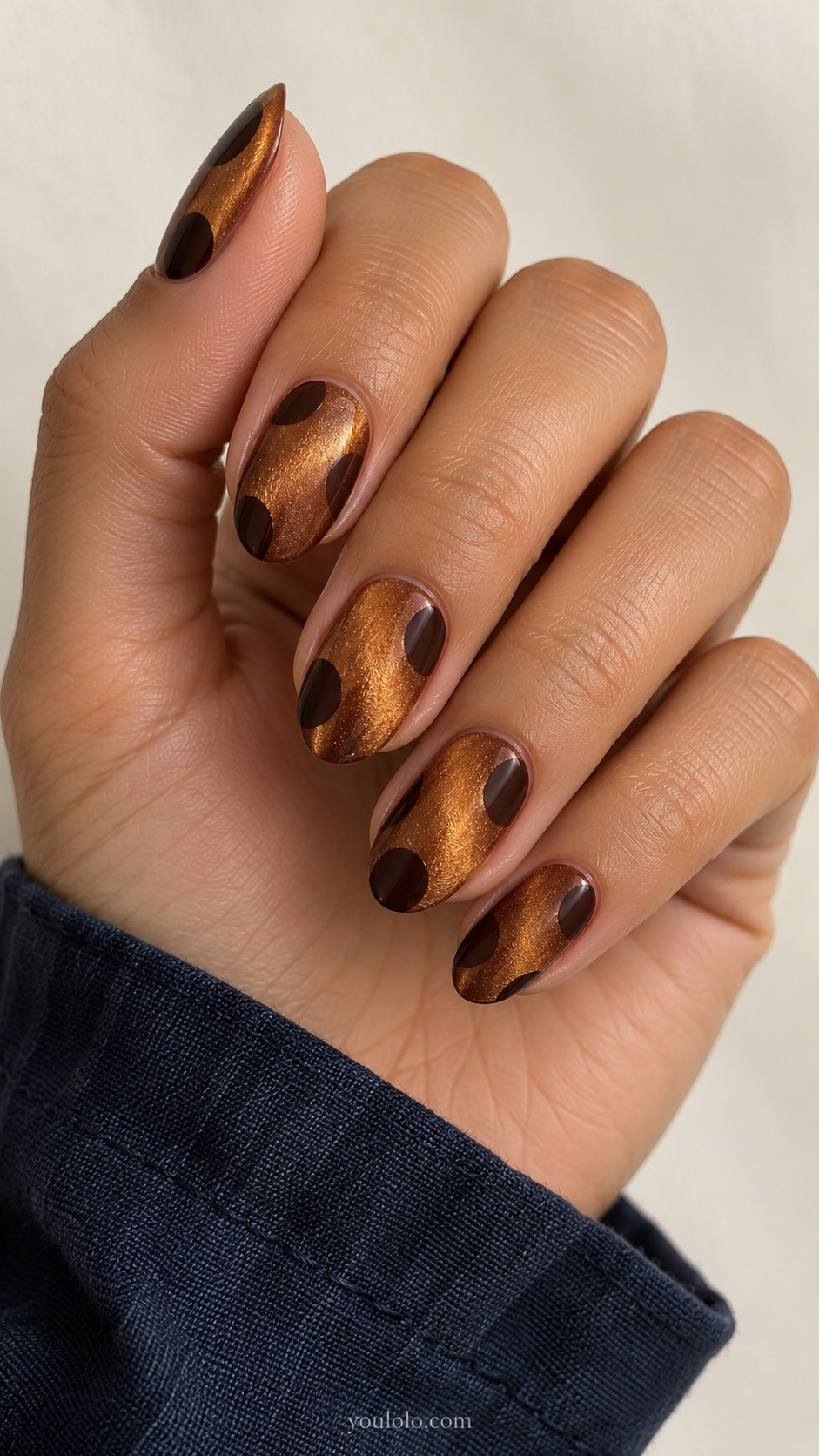 Large Offset Dots on Amber Velvet manicure on medium oval.