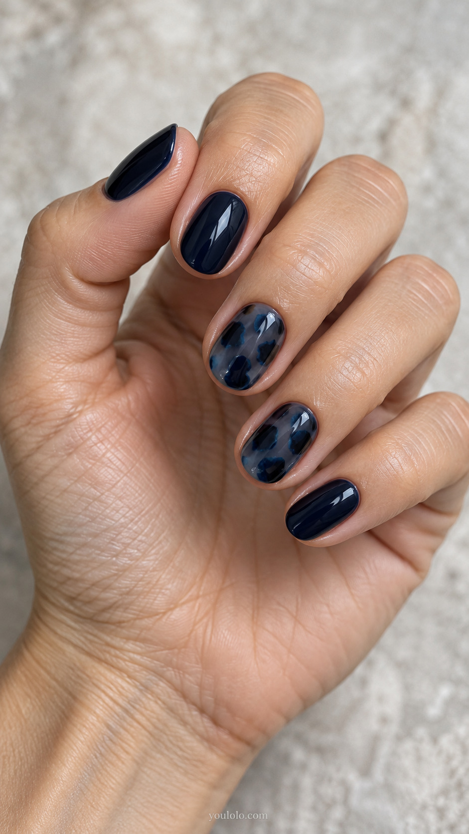 Midnight Blue Tortoiseshell Accent on a naturally posed hand, showing dark blue polish and detailed nail art