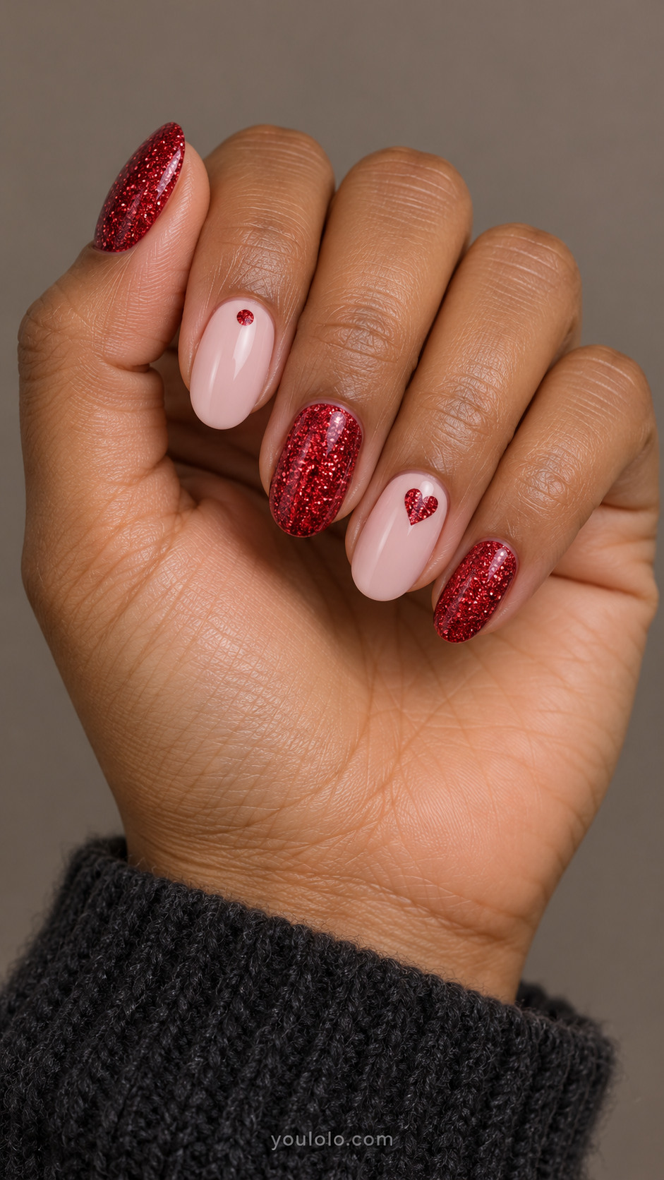 Ruby glitter and blush oval nails with one red glitter heart