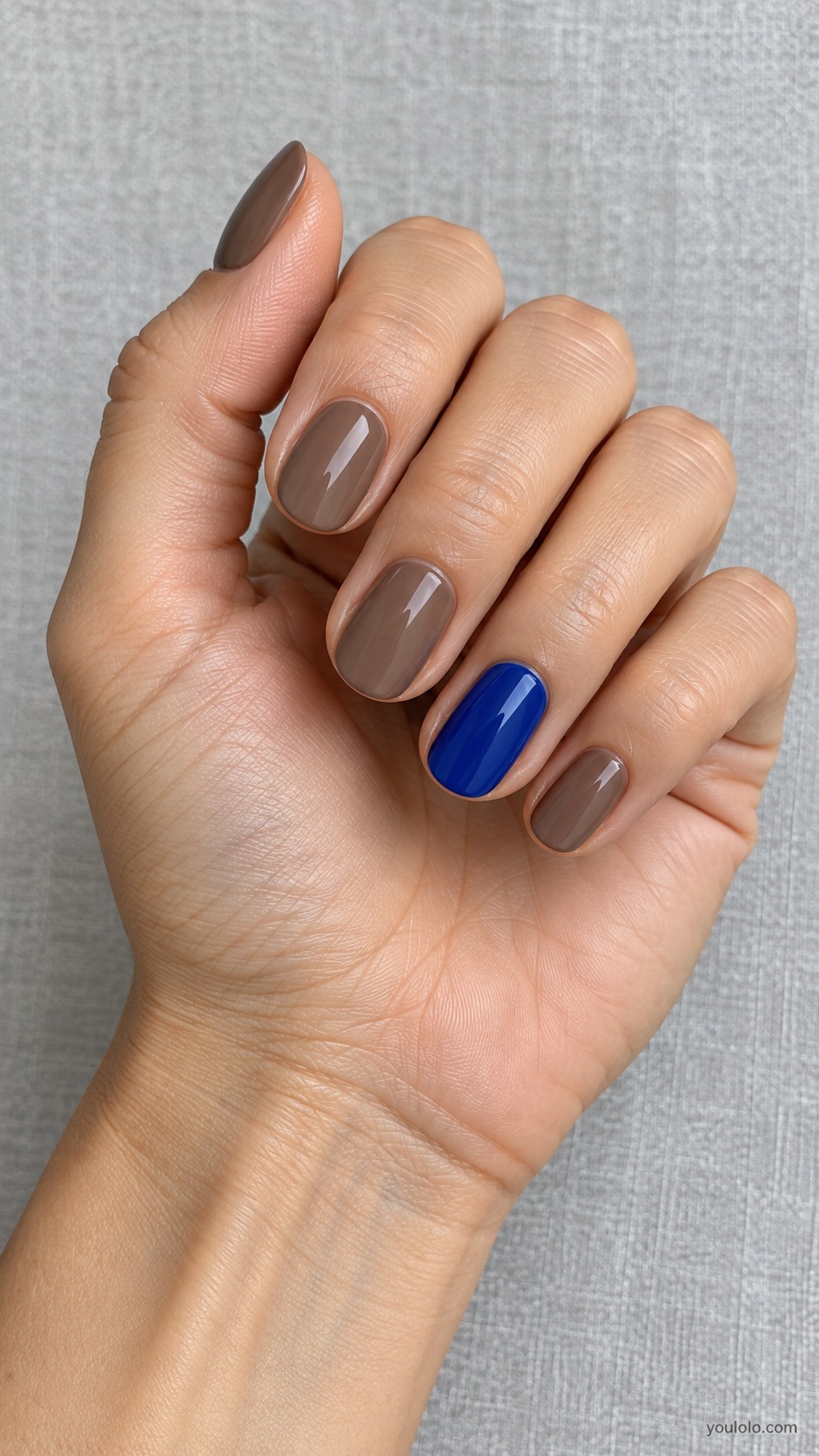 Taupe with Cobalt Accent — short oval four taupe brown nails one cobalt blue ring nail solid creams