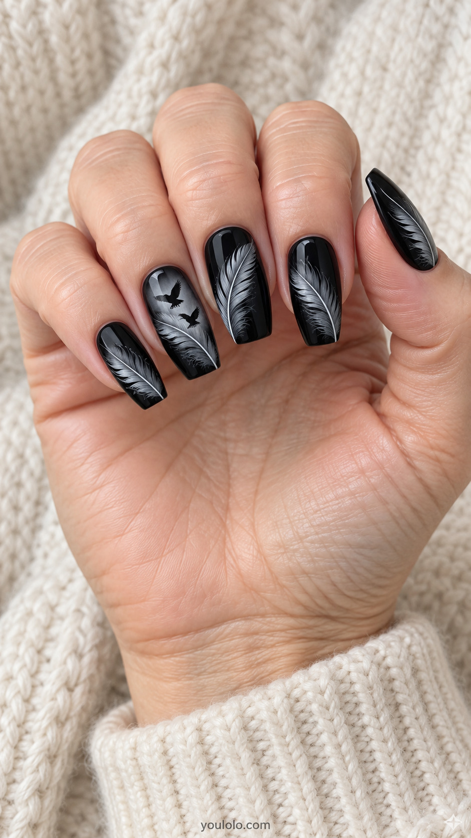 Medium coffin black nails detailed gray feather painting diagonally on each nail, tiny two flying raven silhouettes on one feather, flat painted