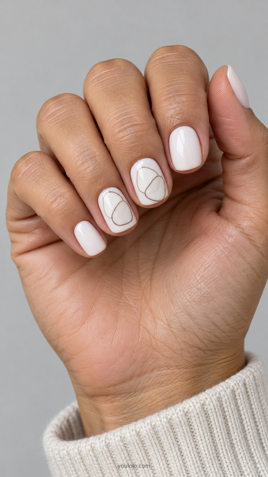 Short white squoval nails with overlapping warm gray pebble outlines