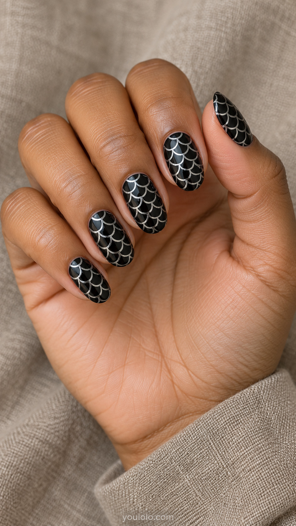 Medium oval black nails repetitive overlapping small silver metallic semicircular scale outlines, airy fine orderly pattern, no thick texture