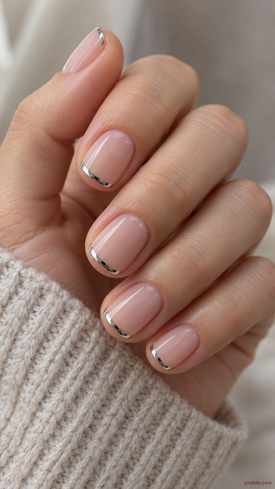Silver Micro French on a naturally gathered feminine hand showing the nail finish