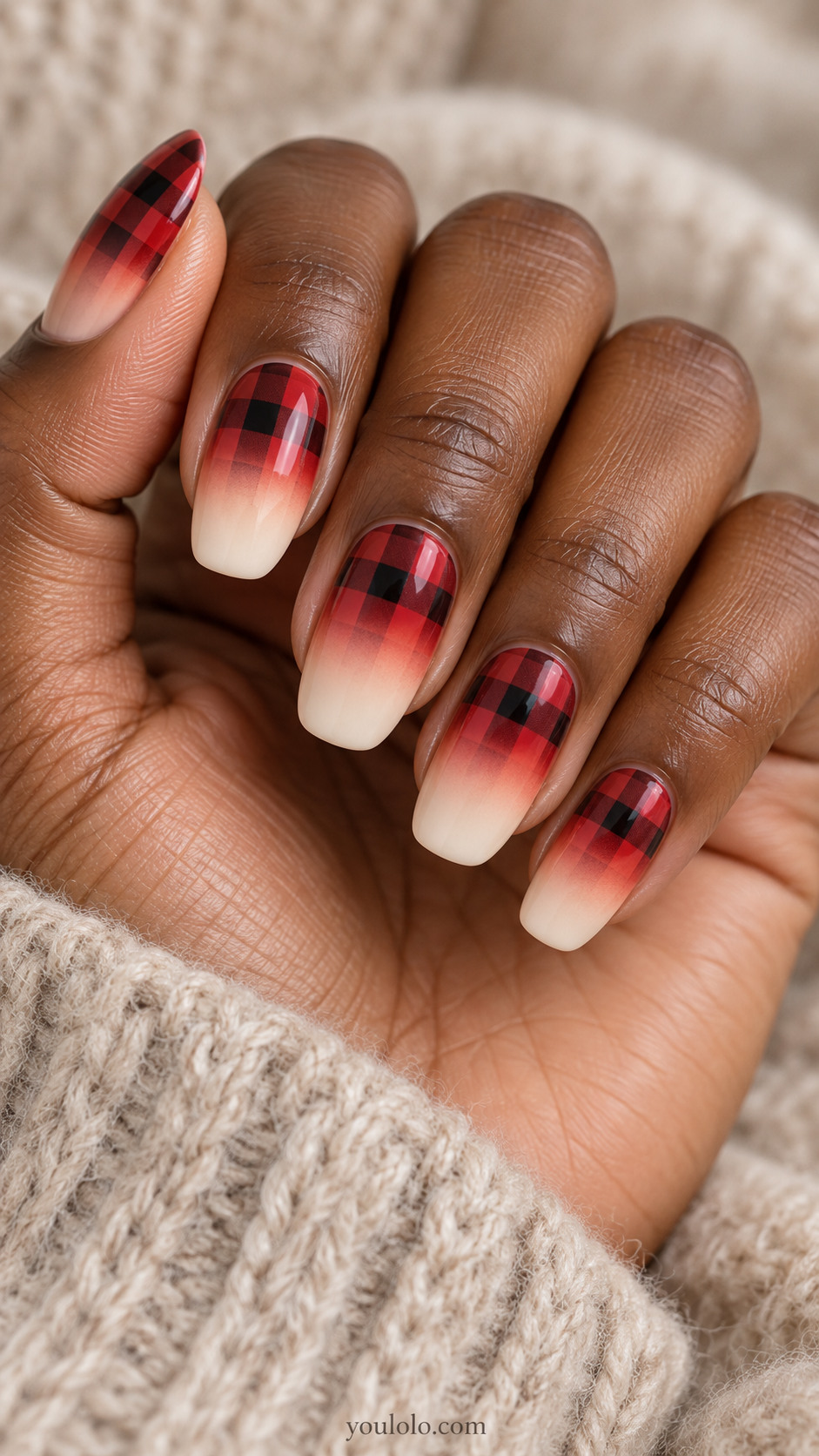 Red-and-black buffalo checks fading toward soft ivory tips on almond nails