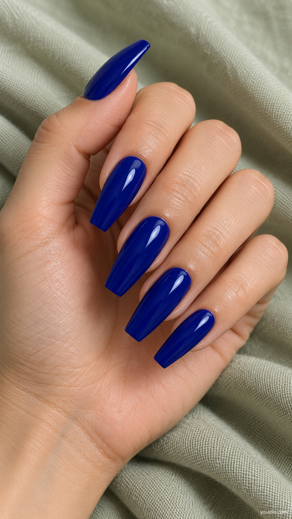Long coffin nails in deep glossy royal blue