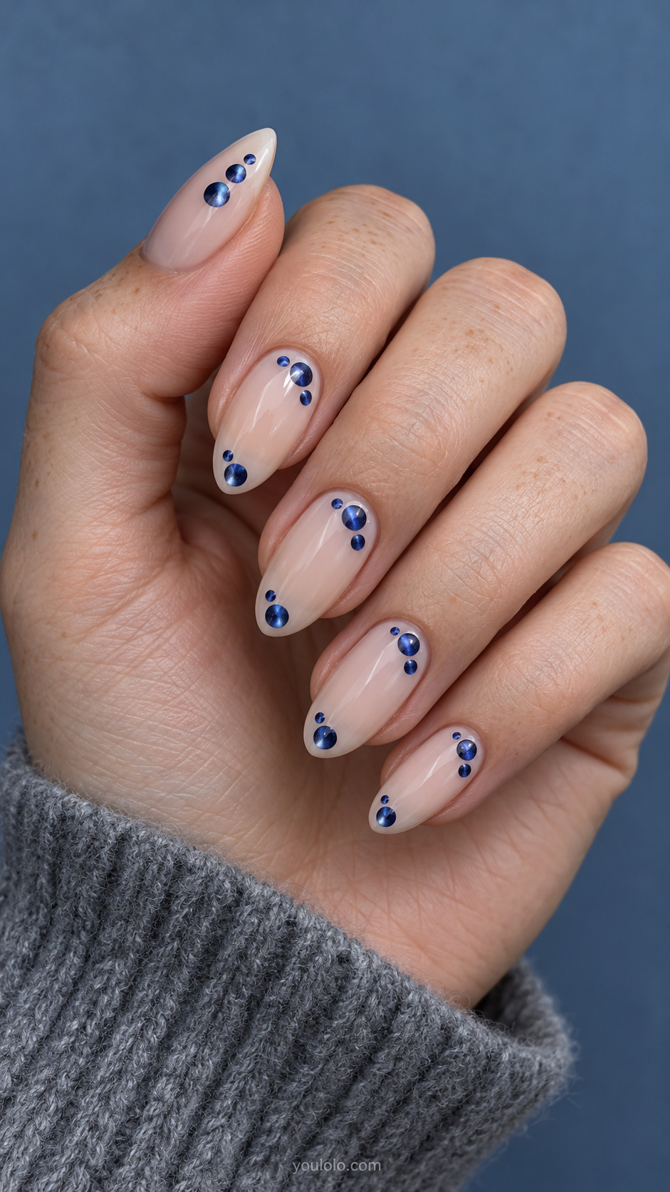 Magnetic Dot Islands on Milky Nude manicure on medium almond.