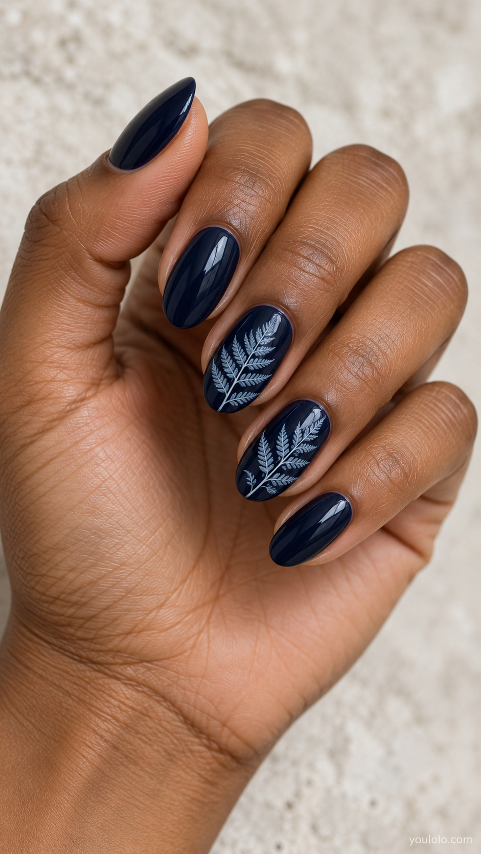 Midnight Blue with Pressed-Fern Linework on a naturally posed hand, showing dark blue polish and detailed nail art