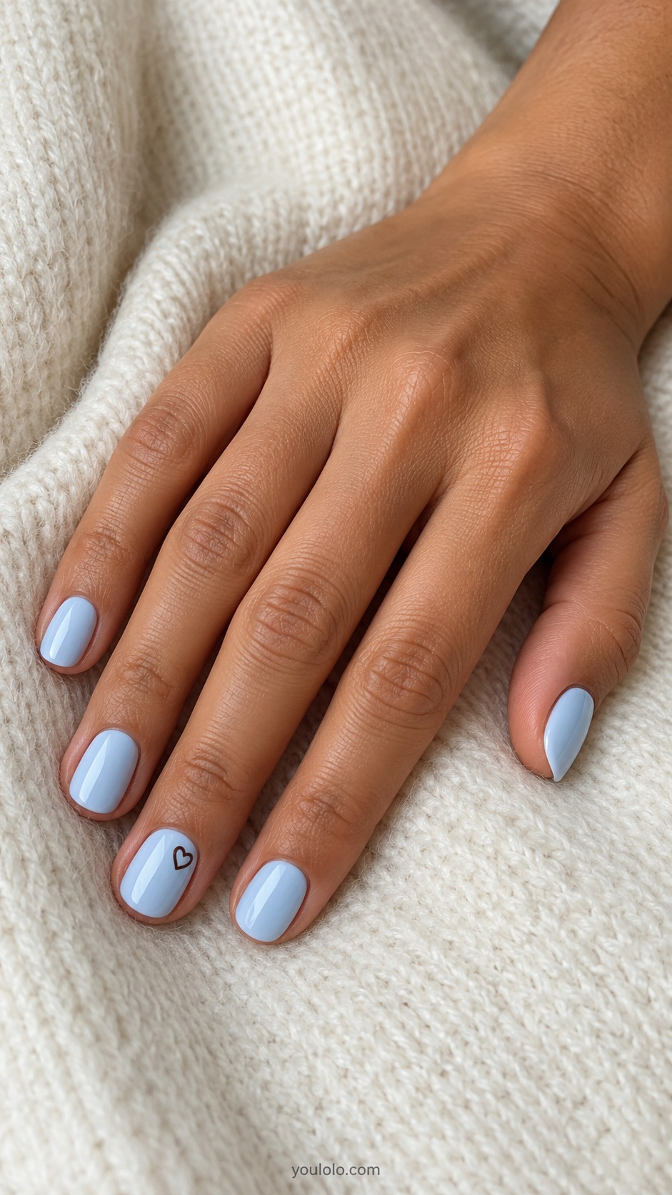 Blue Brown Tiny Hearts — short round pale blue nails one small chocolate outline heart at base of ring nail other nails plain pale blue