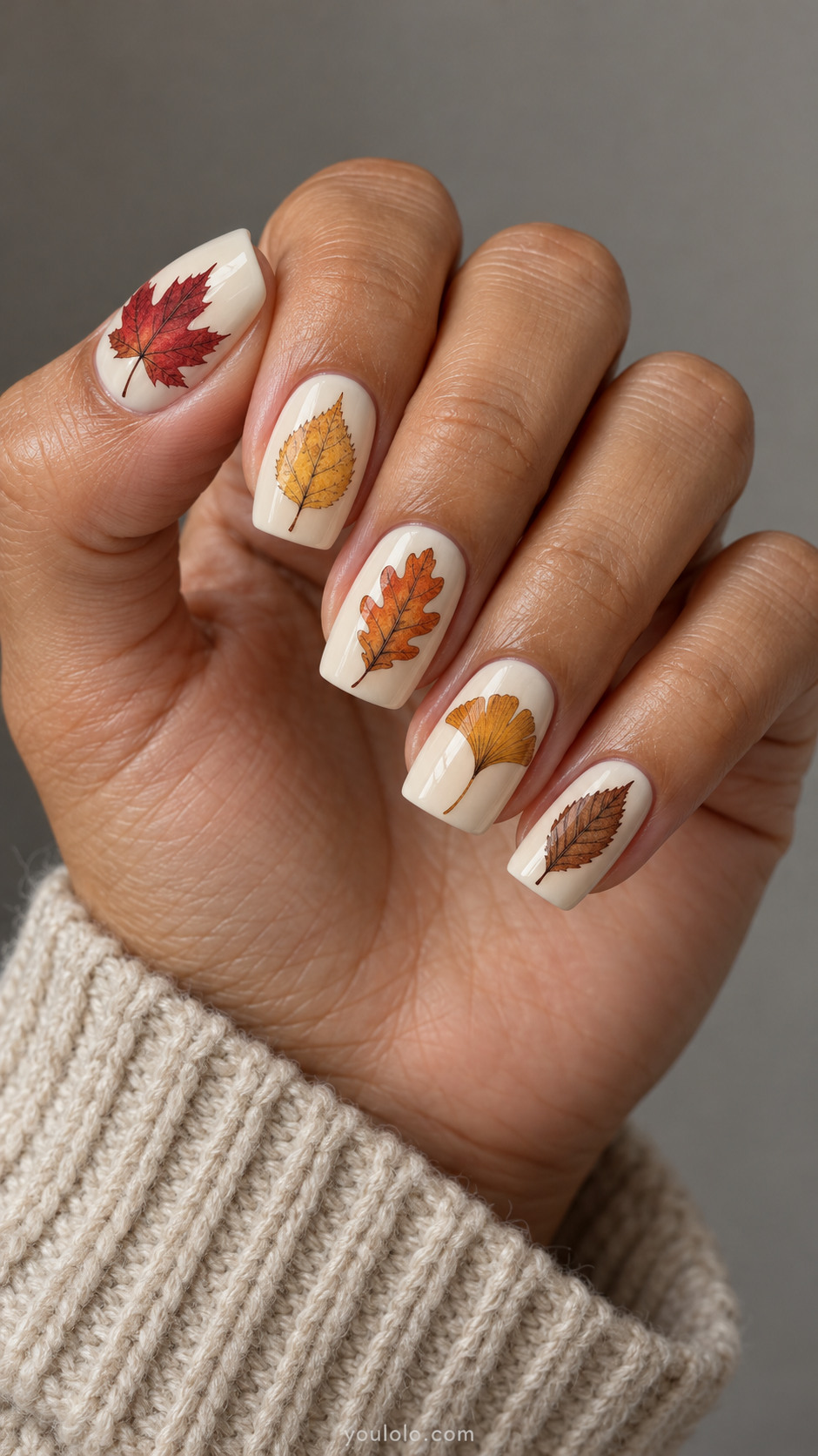 Cream square nails with red maple, yellow birch, orange oak, ochre ginkgo and brown elm leaf illustrations.