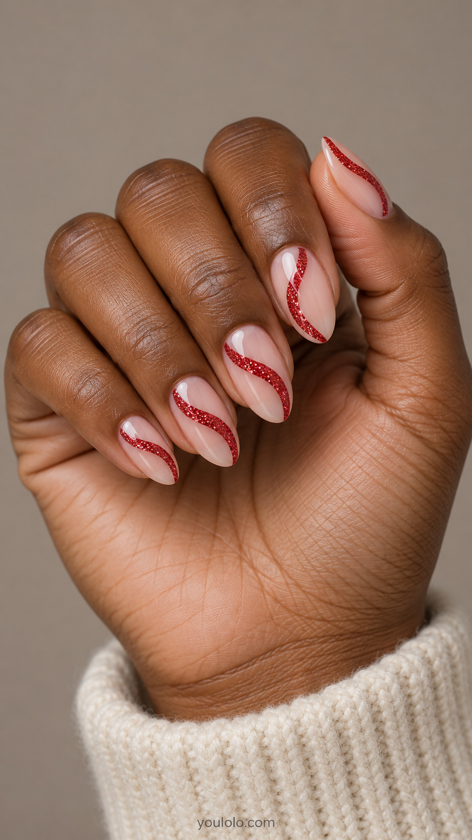 Sheer almond nails with curved red glitter ribbons