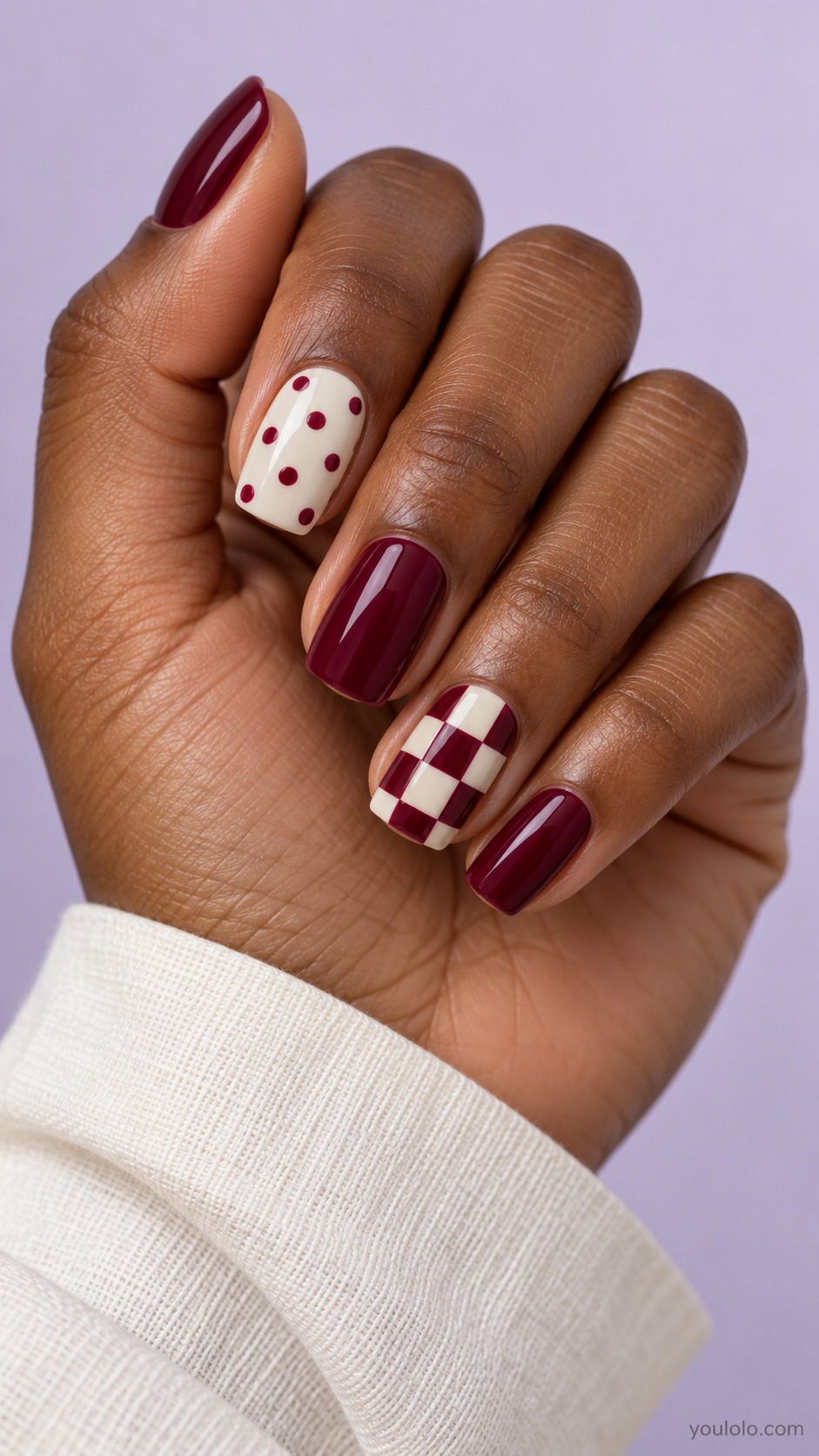 Medium soft square: thumb middle pinky solid merlot, index ivory with burgundy polka dots, ring simple large burgundy-ivory checkerboard.