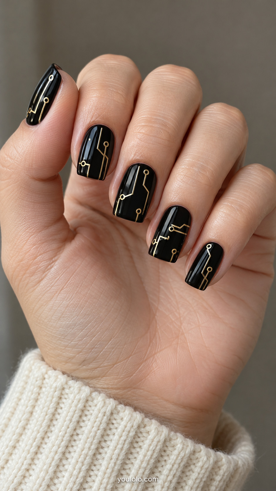 Black squoval nails with fine gold circuit lines and hollow circular endpoints